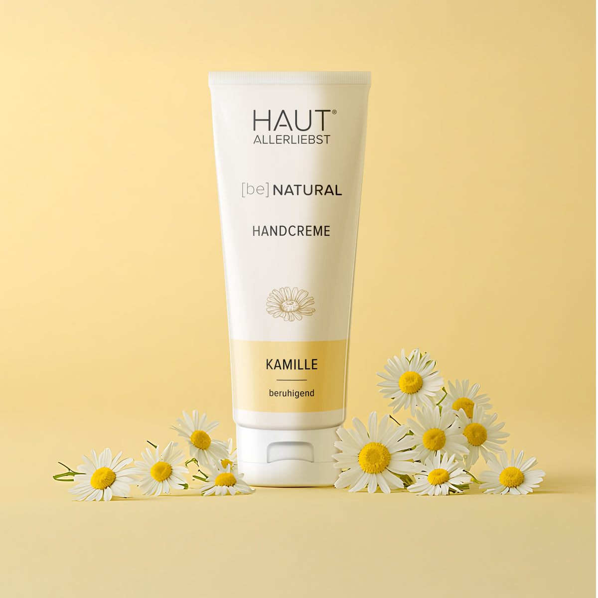 Hautallerliebst be natural Handcreme Kamille mit Kamillenblüten vor gelben Hintergrund
